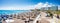 Elli beach with sunshades, sun beds and hotels in city of Rhodes