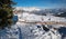 ELLMAU, TIROL/AUSTRIA, December 30th 2019 - mountain panorama Skiwelt Hartkaiser slope with chairlift and skiers, austrian alps