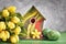 ellow tulips, birdhouse and painted Easter eggs with decorative felt flower