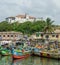 Elmina, Ghana - February 13, 2014: Colorful moored wooden fishing boats in African harbor town Elmina