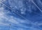 Elongated linear clouds on a blue sky