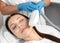 Elos epilation hair removal procedure on the face of a woman. Beautician doing laser rejuvenation in a beauty salon. Facial skin