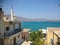 Elounda, Crete, Greece - September 2: Street of a Greek city with sea view. Descent down the street. In the distance you can see
