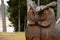 Elva Estonia 04.05.2018 close up of owl bird sculpture carved from wood in forest