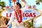 Elvis look-alike impersonator and Las Vegas sign