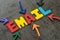 Email, electronic mail sending or newsletter concept, multi color arrows pointing to the word EMAIL at the center of black cement