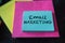 Email marketing handwritten on colorful stacks of sticky note pads