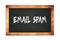 EMAIL  SPAM text written on wooden frame school blackboard