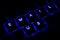 \'Email Us\' Illuminated Keyboard Text in Blue