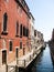 Embankment along the narrow canal in Venice