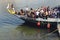 Embankment of the Douro River, resting tourists. A pair of lovers kiss on the river bank. Romantic journey