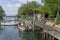 embankment with fishing tackle and boats at Punta Sdobba little harbor, Grado, Friuli, Italy