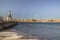 The embankment of the Neva with a church on one shore and cathedral on another, remnants of ice bright warm spring day