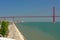 Embankment of river Tagus and bridge of 25th April in the port of Lisbon,