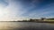 Embankment with stones passes over the Black sea against the backdrop of a sunny sky