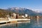 Embankment of Tivat city with Lovcen mountain in the background on sunny winter day.  Montenegro, Bay of Kotor