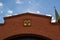 The emblem of Russia above the gates in the Kremlin wall. Moscow