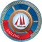 Emblem with steering wheel, sailboat and ribbon