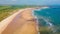 Embleton Bay and Burn beach with the ruins of Dunstanburgh Castle