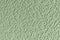 Embossed abstract pattern on a light green paper