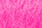 Embossed pink wall in side lighting. pink background for romantic