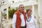 Embrace, smile and old couple outside hotel, villa and love on luxury retirement vacation together. Marriage, travel and