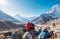 Embracing Couple on the Everest Base Camp trekking route near Dughla 4620m. Backpackers left Backpacks and trekking poles and