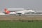 A embraer 190 landing on the runway