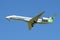 The Embraer ERJ-145LR plane onboard VQ-BWU Airline Komiaviatrans in the blue sky