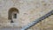 An embrasure and a staircase on the stone wall of an ancient for