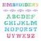 Embroidered alphabet. Colorful vector illustration. Embroidery f