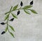 Embroidery of olive branch on linen beige fabric
