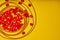 Embroidery products and tools. Embroidery thread and red roundels on yellow background