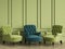 Emerald classic tufted chair among green chairs are standing in an empty room