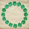 Emerald green paper clover shamrock leafs wreath border