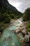 Emerald green river Soca in Slovenia, alpine mountain river