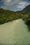 Emerald green river Soca in Slovenia, alpine mountain river