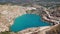 Emerald lake in a flooded quarry. Emerald green lake in flooded opencast mine. Oval lake in mining industrial crater