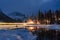 Emerald Lake with wooden lodge glowing in snowy pine forest on winter at Yoho national park