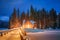 Emerald Lake with wooden lodge glowing in snowy pine forest on winter at Yoho national park