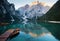 Emerald Mountain Lake Braies. boat station. Wooden pier. Morning landscape in Italy