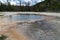 The Emerald Pool hot spring geyser in Black Sand Basin in Yellowstone National park