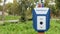 Emergency button in a public city park with an English word emergency. SOS, police, panic. People safety concept. Emergency call