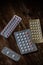 Emergency contraceptive pills and Birth control pills on a dark background.
