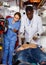 Emergency doctor resuscitating male patient with help of defibrillator