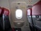 Emergency exit window in aircraft cabin. Long leg room seat. premium seat. Emergency exit seat.