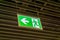 Emergency fire exit sign glowing green