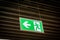 Emergency fire exit sign glowing green