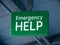 EMERGENCY HELP sign hanging from grey roof