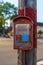 Emergency Reporting System box to notify the police and fire department n old wooden pole